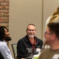 two people laughing at luncheon table